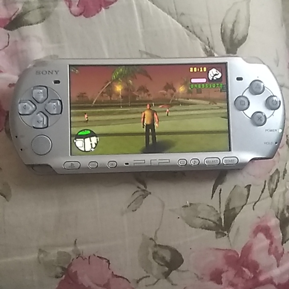Vintage Sony PSP3001  w game and adapter And memory card. 125$ obo